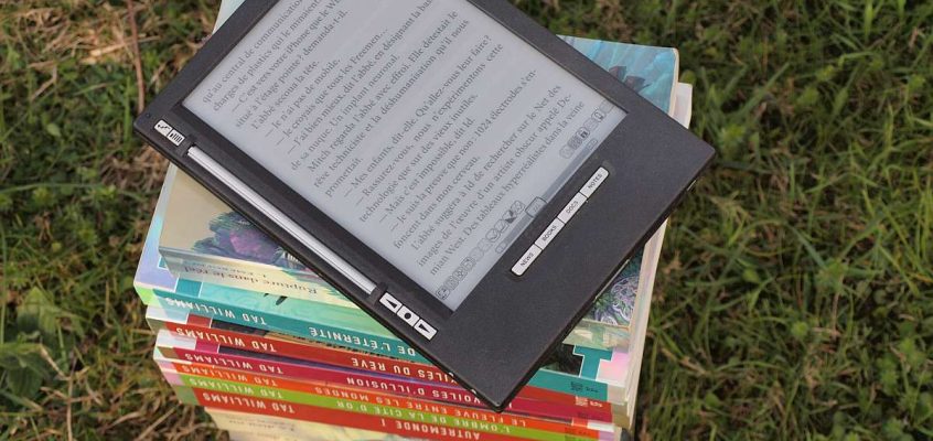 E-reader on a pile of books